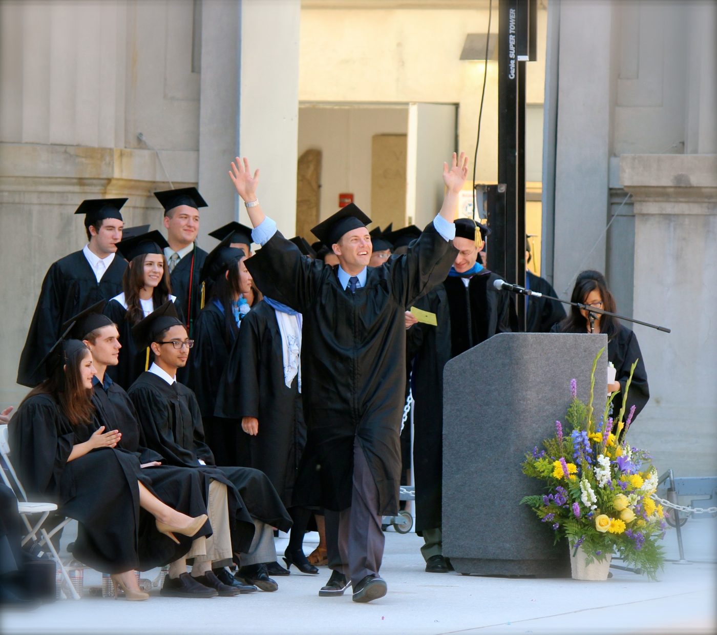 Graham Farmer celebrating on stage at his UC Berkeley College of Engineering commencement